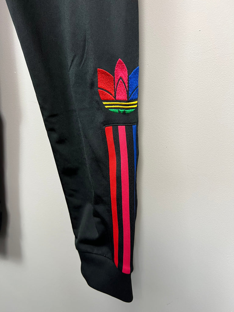 Adidas black poly joggers with red/pink/blue 3 stripes 12-13y - leg
