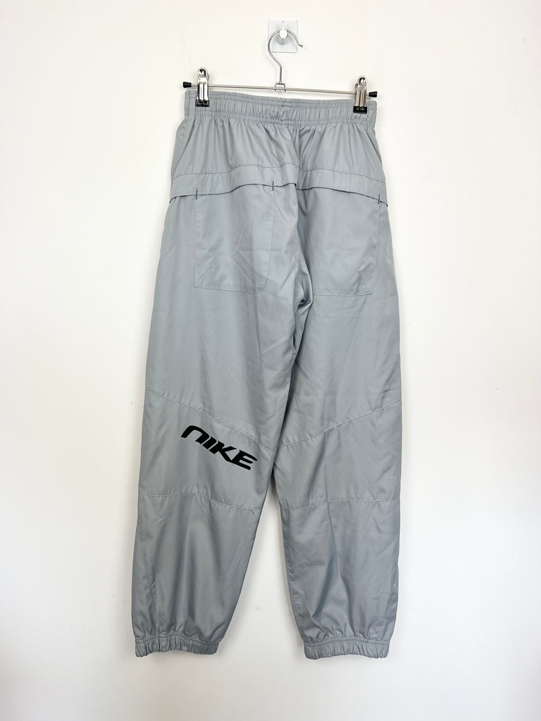 Second hand older kids Nike grey poly tracksuit bottoms 12-13y - Sweet Pea Preloved Clothes